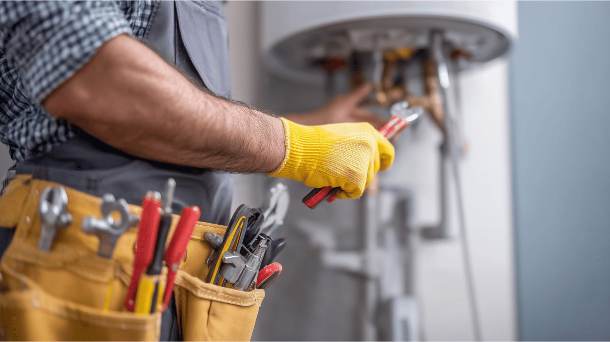 A technician services a home heating system